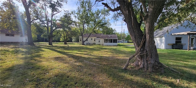 view of yard with a sunroom