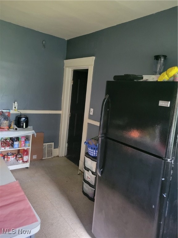 interior space featuring black refrigerator