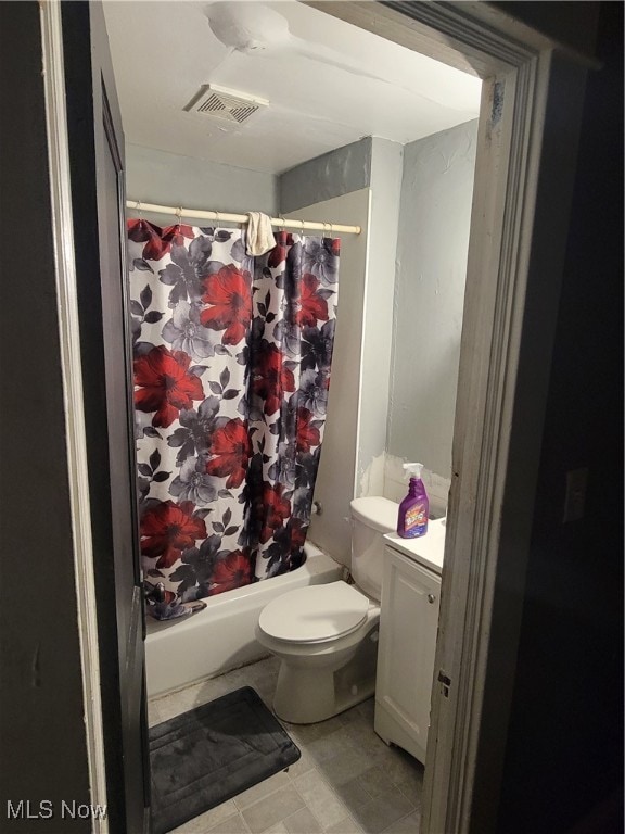 full bathroom featuring shower / bath combination with curtain, vanity, and toilet