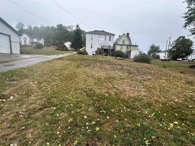 view of yard featuring a garage