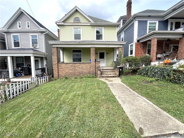 view of front of property featuring a front yard and a porch