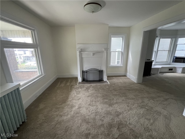 unfurnished living room with carpet floors and cooling unit