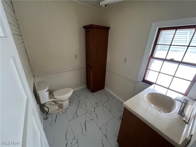 bathroom featuring vanity and toilet