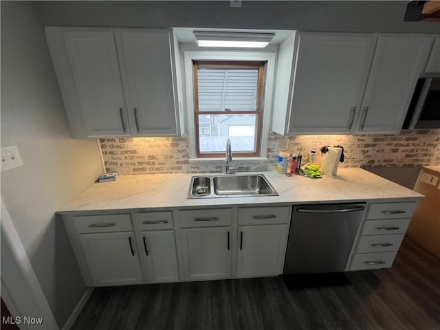 kitchen with dishwasher, dark wood-type flooring, sink, and white cabinets