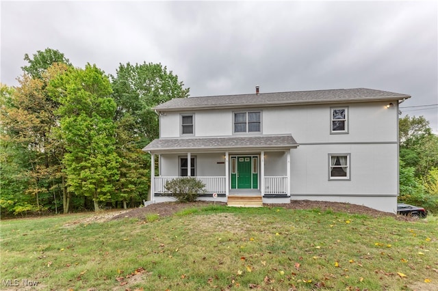 view of front of property featuring a porch and a front yard