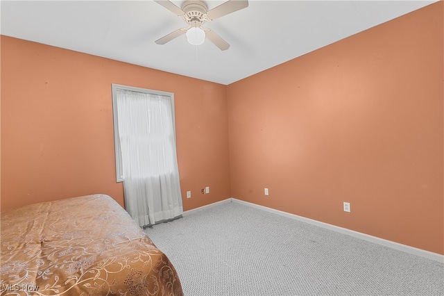 bedroom featuring ceiling fan and carpet floors