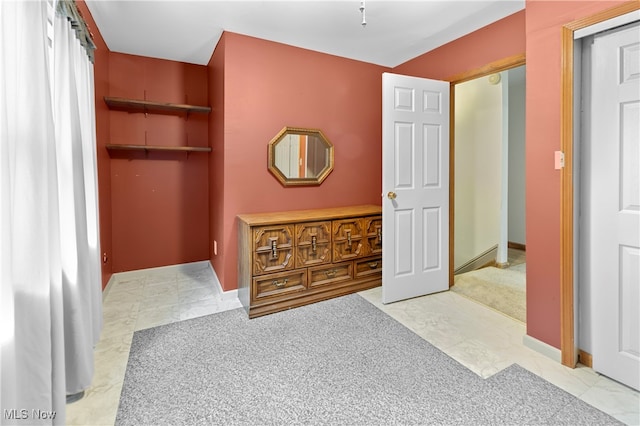 bedroom with light carpet and a closet