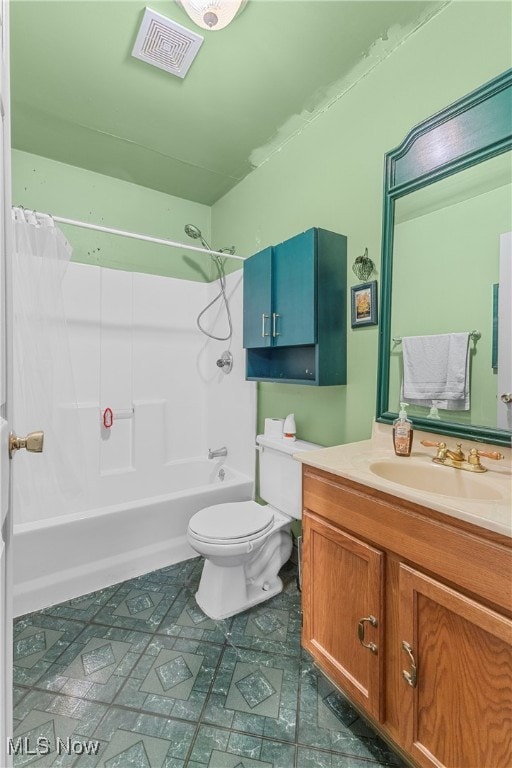 full bathroom featuring shower / tub combo, vanity, and toilet