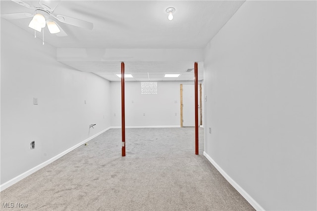 basement featuring ceiling fan and carpet flooring