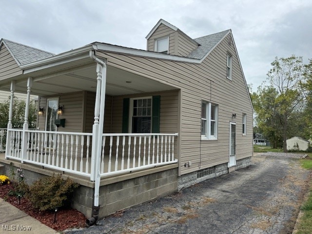 view of home's exterior with covered porch