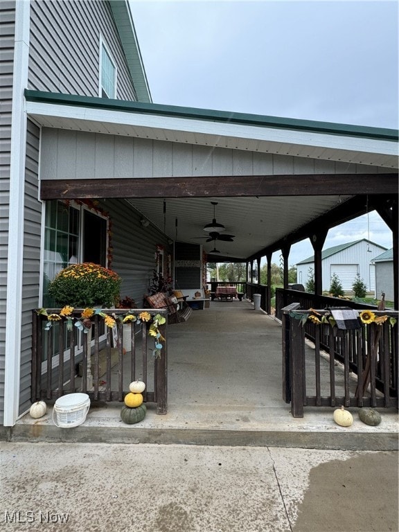 exterior space with ceiling fan