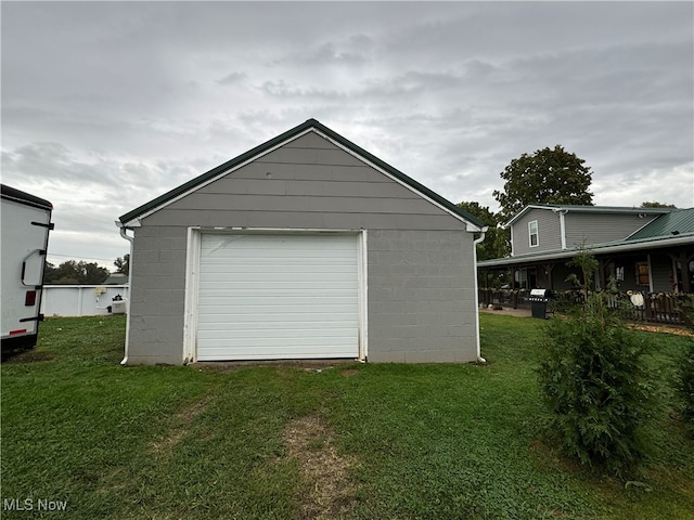 garage featuring a yard