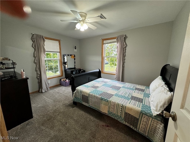 carpeted bedroom with ceiling fan