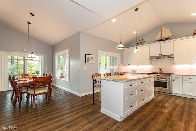 kitchen featuring a center island, hanging light fixtures, high end stainless steel range, white cabinets, and dark hardwood / wood-style floors