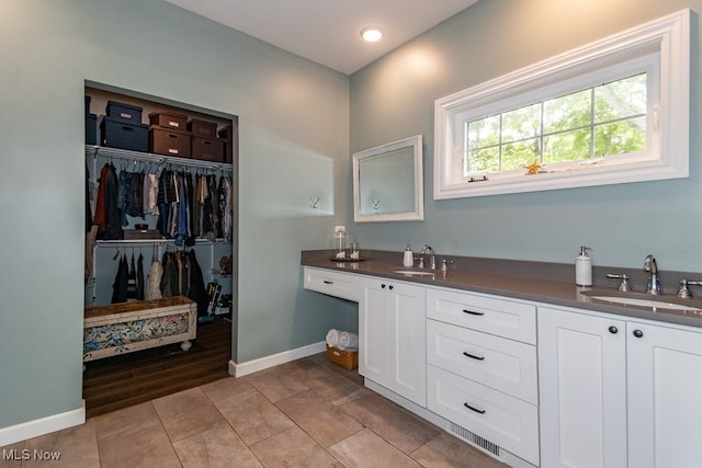 bathroom with vanity and hardwood / wood-style floors