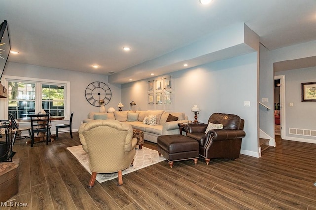 living room featuring dark wood-type flooring