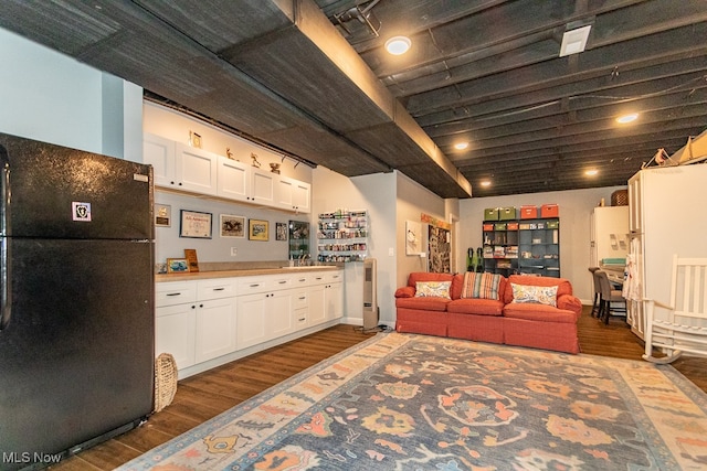 living room with dark hardwood / wood-style flooring