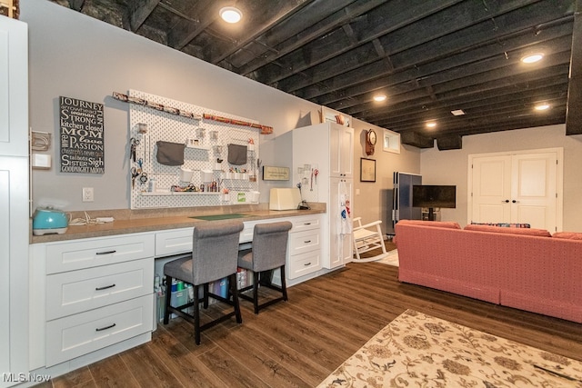 interior space featuring dark hardwood / wood-style floors and built in desk