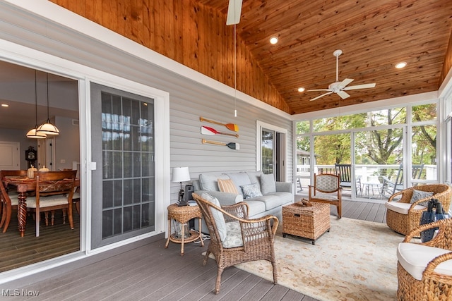 sunroom / solarium with ceiling fan, lofted ceiling, and wood ceiling