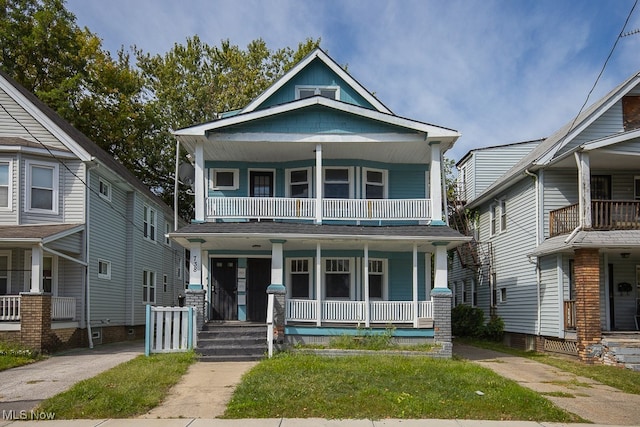 view of front of home with a balcony and a porch