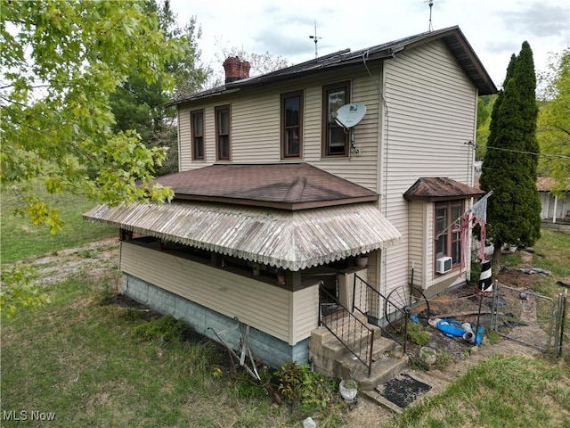 10206 Gillespie Run Rd, Petroleum, WV 26161 - rear view of property featuring a chimney and cooling unit