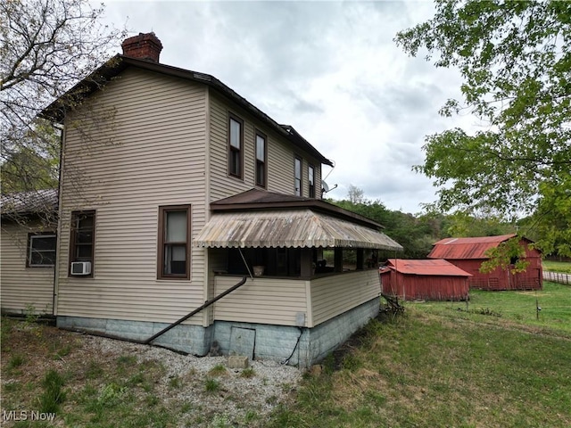 10206 Gillespie Run Rd, Petroleum, WV 26161 - view of side of property with a chimney, a yard, cooling unit, and entry steps