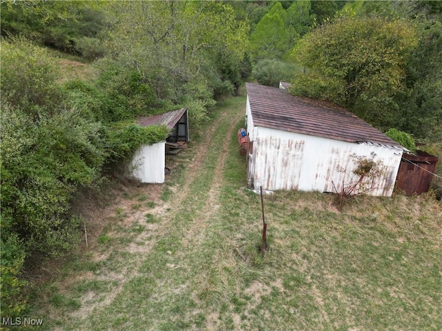 10206 Gillespie Run Rd, Petroleum, WV 26161 - view of pole building featuring a wooded view and a lawn
