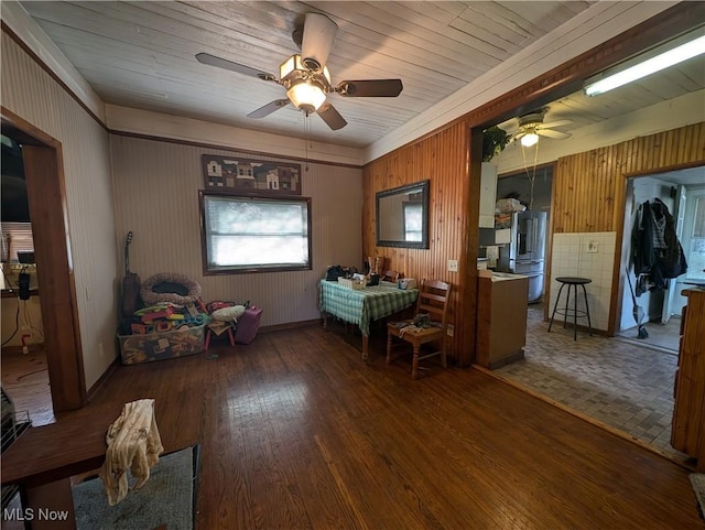 10206 Gillespie Run Rd, Petroleum, WV 26161 - dining area featuring a ceiling fan, wood finished floors, and wooden walls