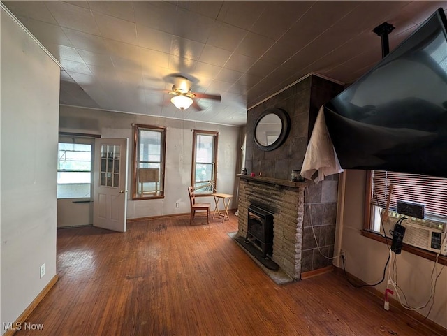 10206 Gillespie Run Rd, Petroleum, WV 26161 - living area featuring wood finished floors, baseboards, ceiling fan, and plenty of natural light