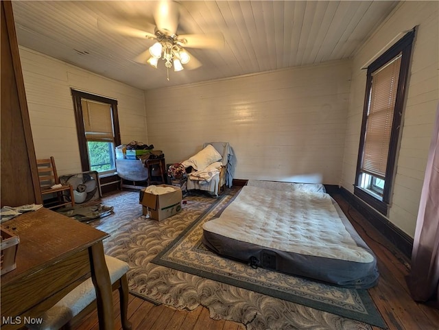 10206 Gillespie Run Rd, Petroleum, WV 26161 - living area with hardwood / wood-style flooring, ceiling fan, and wood walls