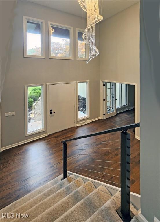 interior space featuring dark hardwood / wood-style floors and a chandelier