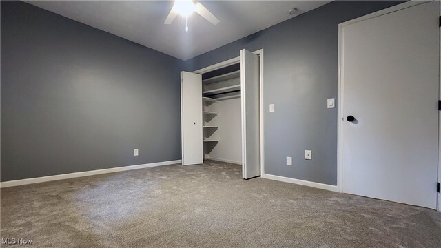 unfurnished bedroom with ceiling fan, carpet floors, and a closet