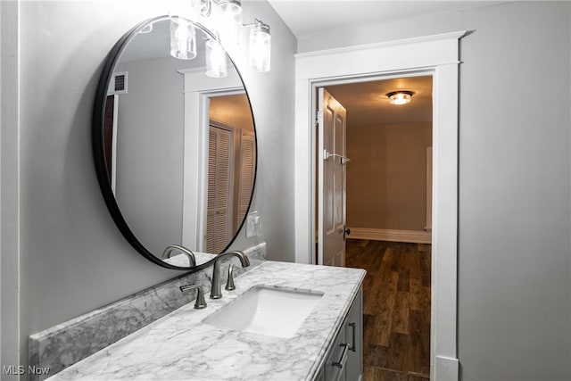 bathroom featuring vanity and hardwood / wood-style flooring