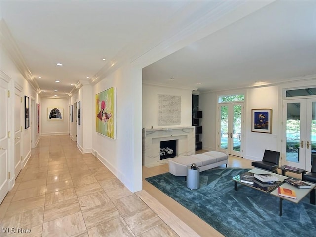 living room featuring french doors and crown molding