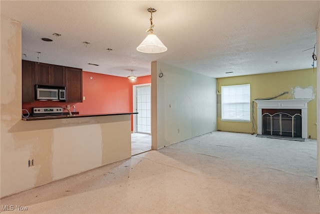 unfurnished living room with a textured ceiling