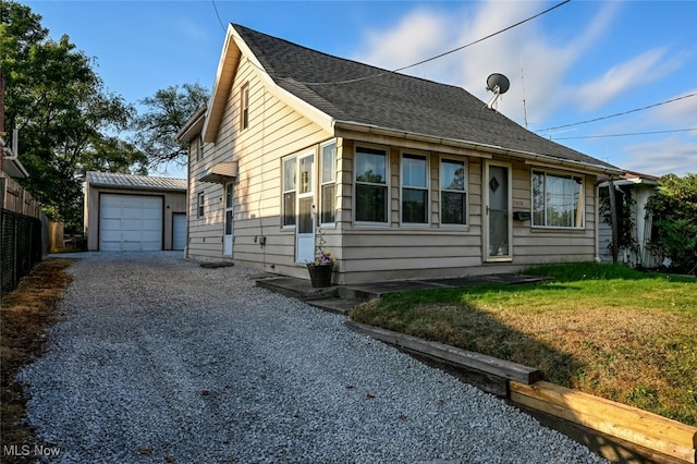 view of property exterior with a lawn and a garage