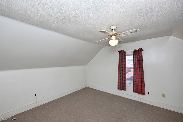 bonus room featuring a textured ceiling, carpet, lofted ceiling, and ceiling fan