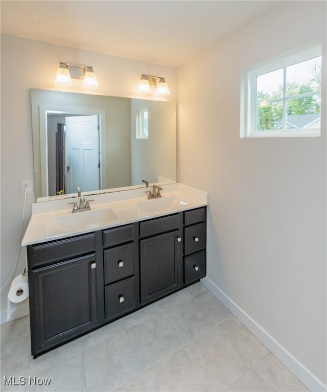 bathroom featuring tile patterned flooring and vanity