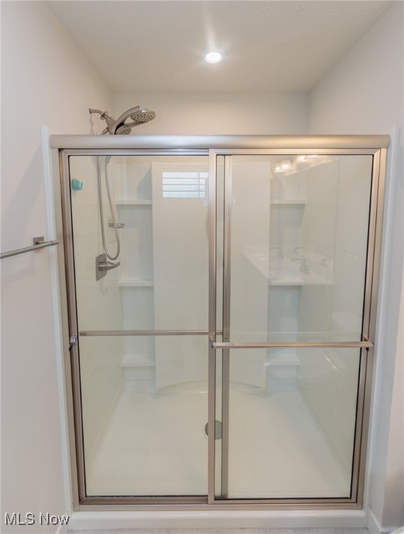 bathroom with an enclosed shower