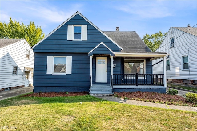 bungalow-style house featuring a front yard