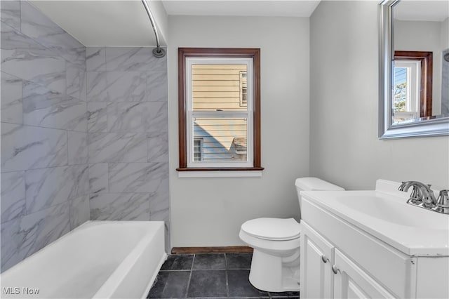 full bathroom featuring tile patterned flooring, vanity, toilet, and tiled shower / bath