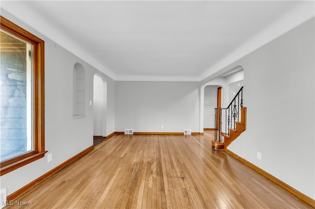 unfurnished room with light hardwood / wood-style flooring