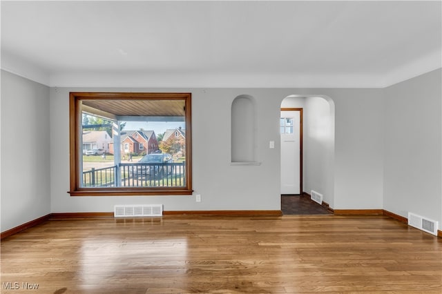 empty room with light hardwood / wood-style flooring