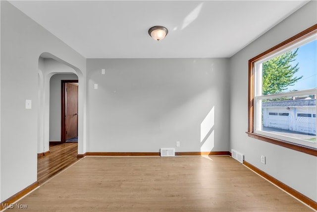 unfurnished room featuring light hardwood / wood-style floors