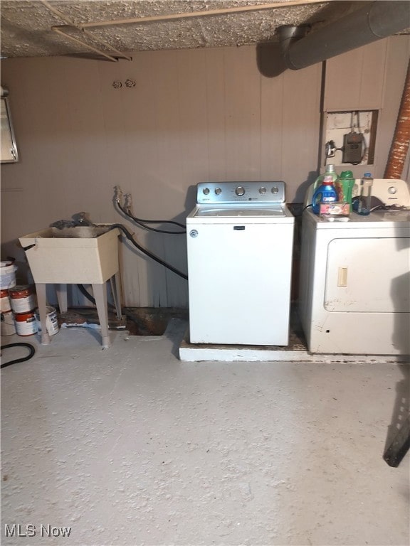 laundry area with separate washer and dryer