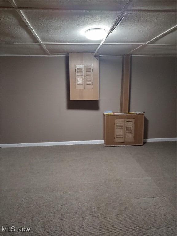 basement with carpet flooring