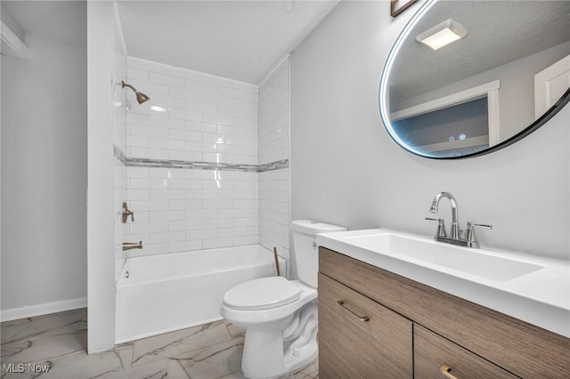 full bathroom with a textured ceiling, tiled shower / bath, vanity, and toilet