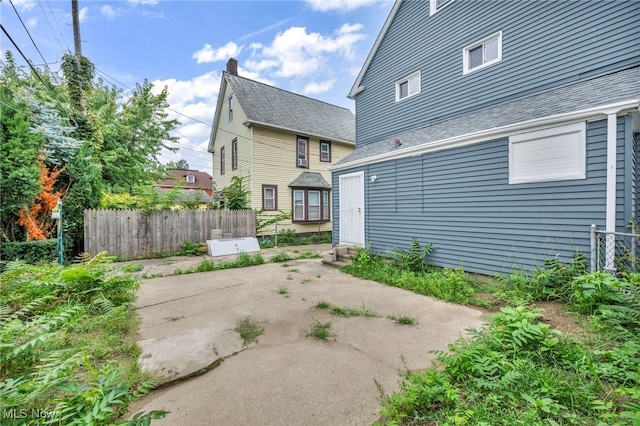 back of house with a patio