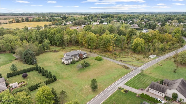 birds eye view of property with a rural view