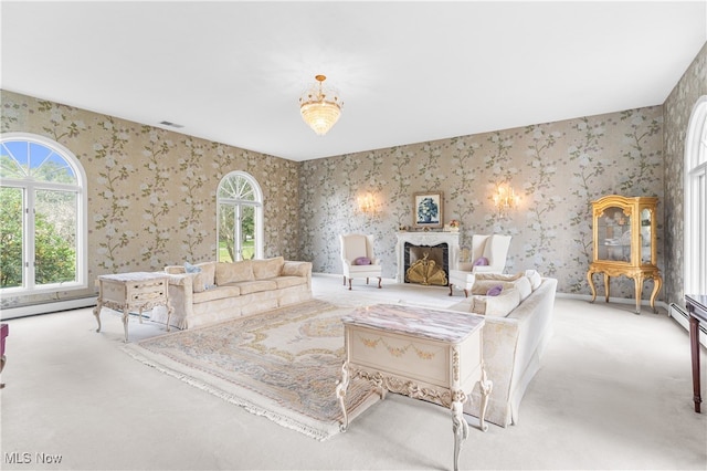 living room featuring light colored carpet and a baseboard radiator